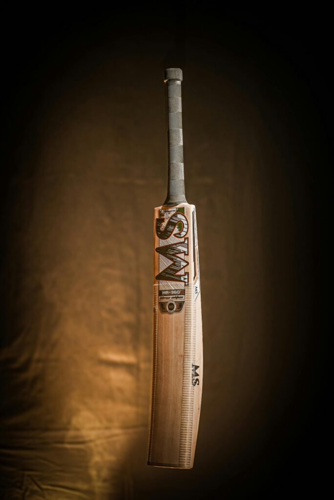 Premium cricket bat displayed against a dramatic dark backdrop, perfect for sports equipment promotions.